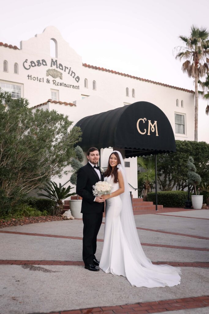 Bride and groom in front of Casa Marina Jacksonville Florida