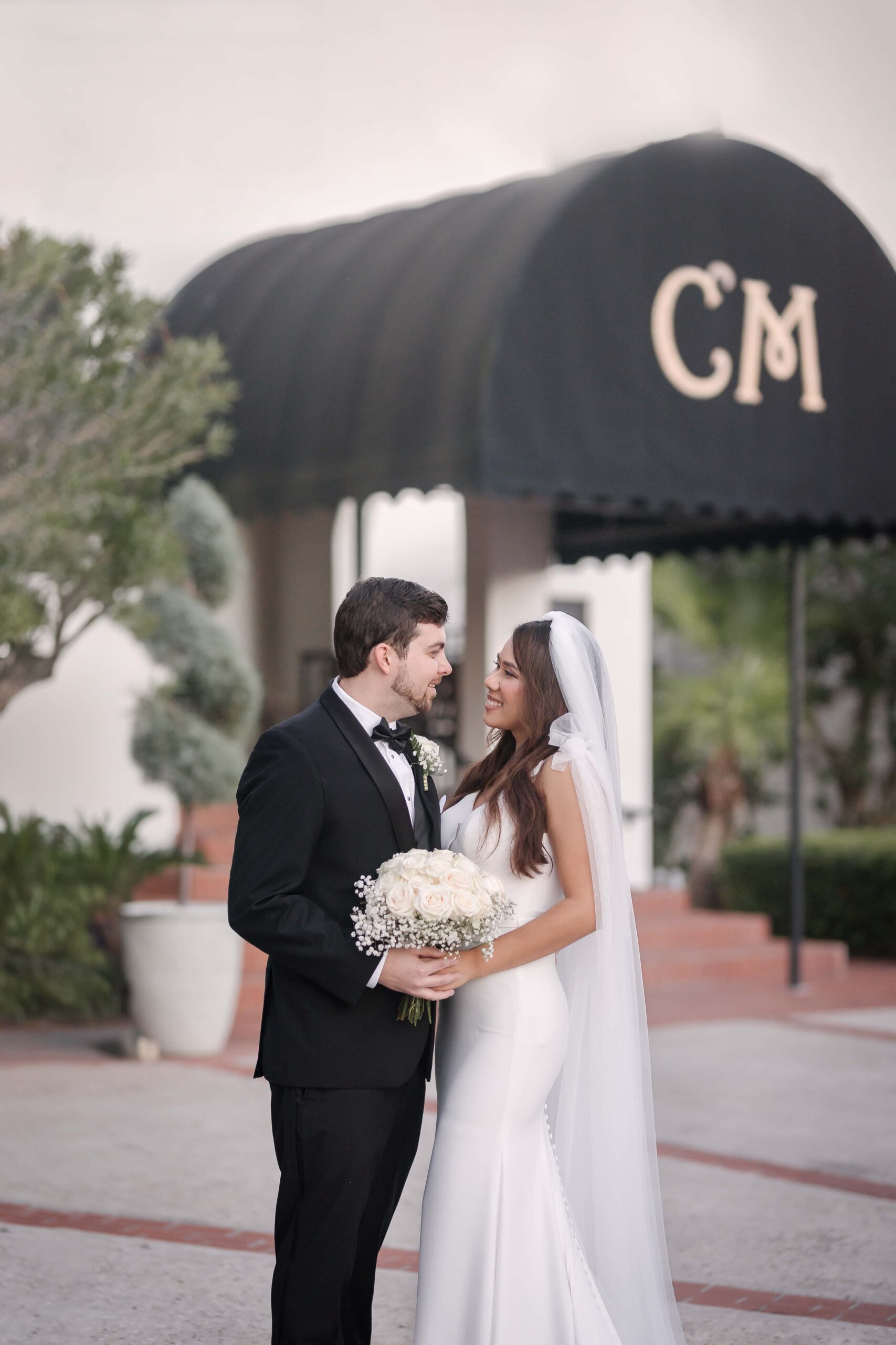 Bride and groom in front of Casa Marina, Jacksonville FL