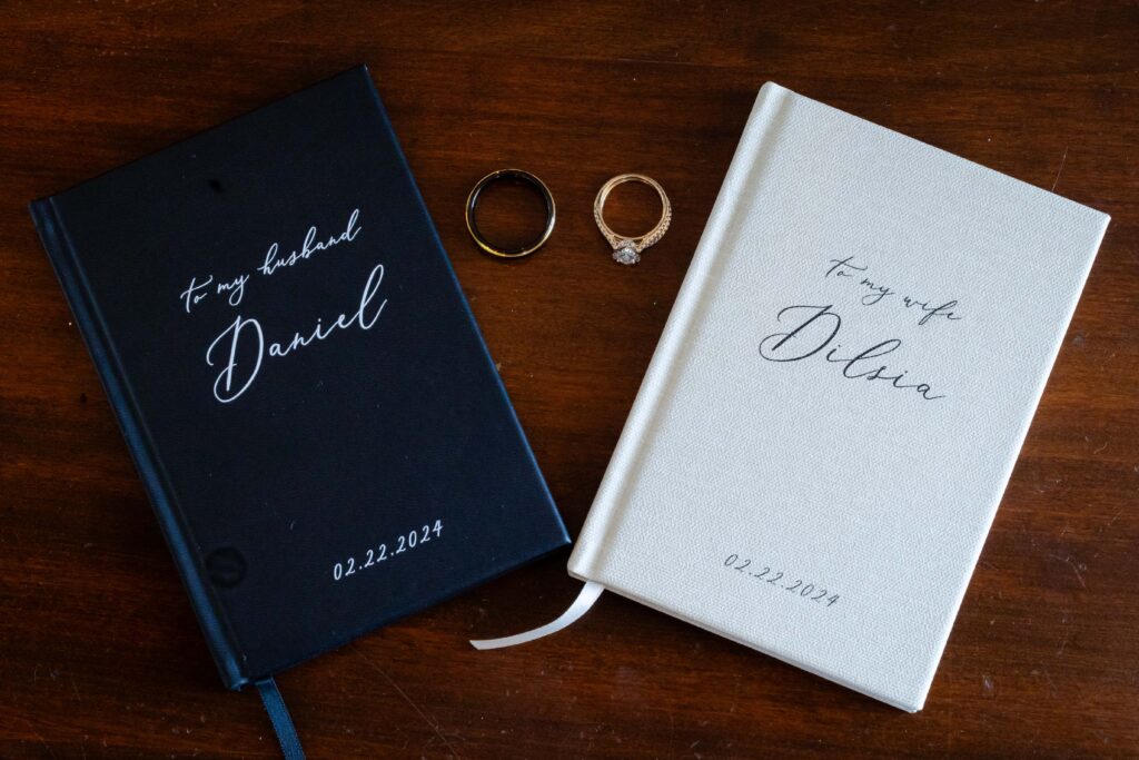 Wedding vow books with bride and groom's rings at The Highland Manor in Apopka, Florida | Wedding Photos by Phavy Photography - Orlando Wedding Photographer