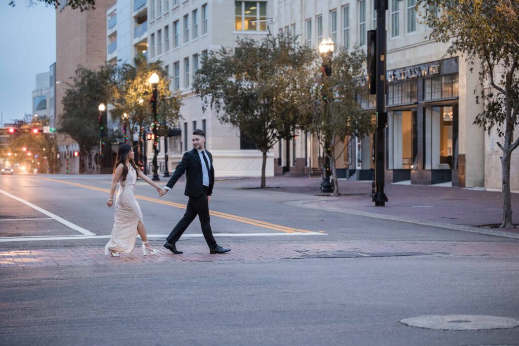 Classy couple walking downtown during their candid engagement shoot | Jacksonville, FL