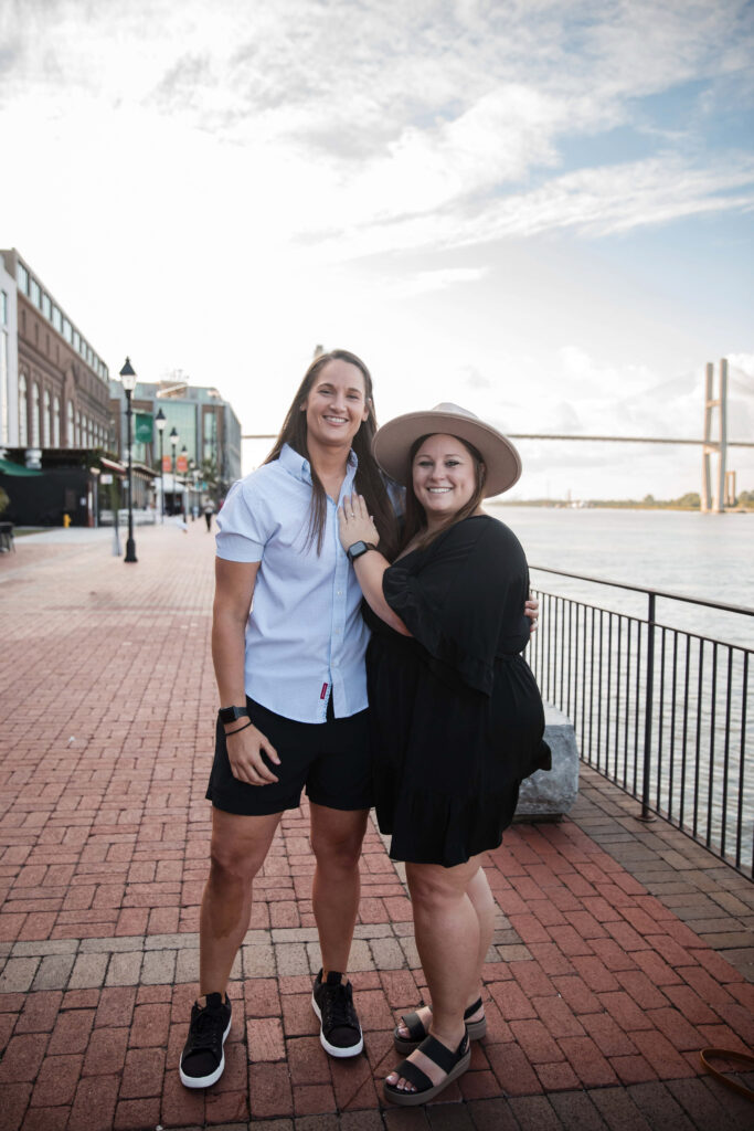 Engagement photos after a proposal at the Savannah Riverwalk