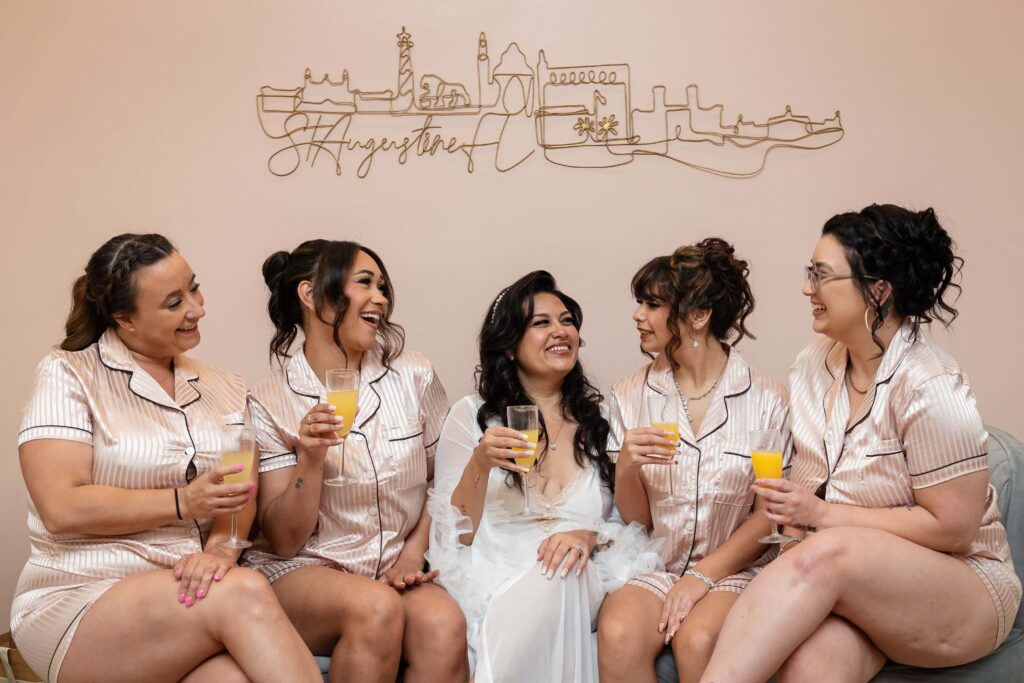 Bridesmaids enjoying their time with the brides before the wedding at the Treasury