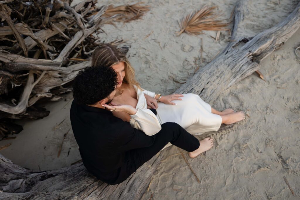 Artistic aerial photo of beach engagement at Driftwood Beach, Georgia