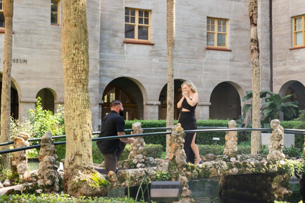 A Surprise proposal at the Lightner Museum Courtyard | Photographed by Phavy Photography, Florida Proposal Photographer