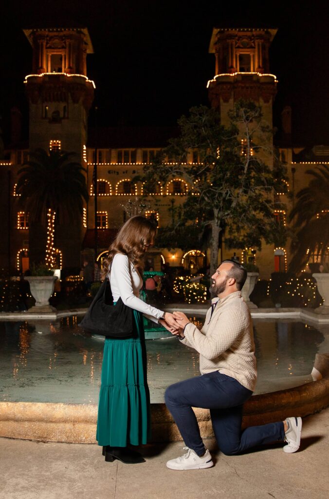 Proposing in front of the Lightner Museum during Nights of Lights