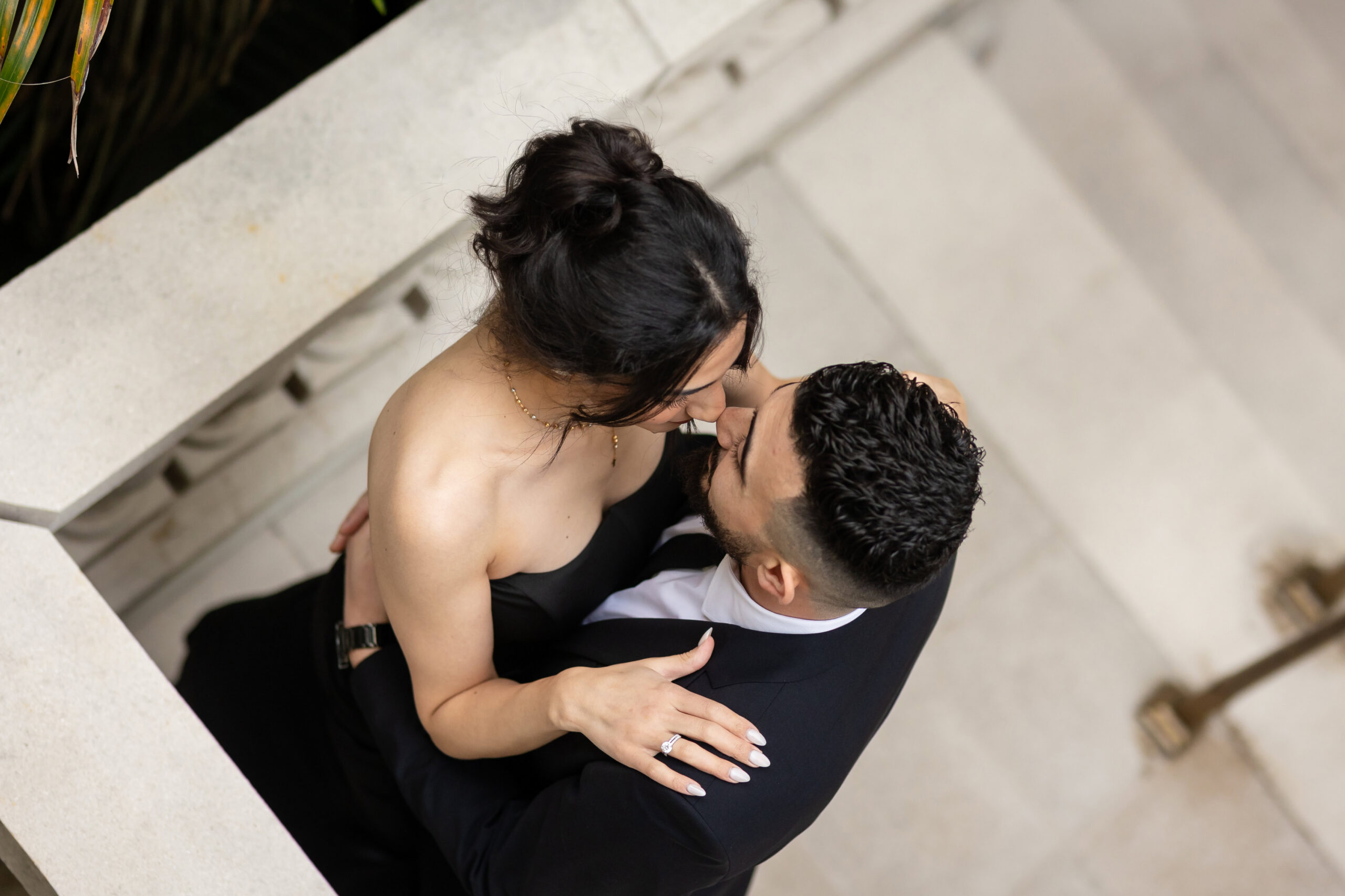 Couple dressed in classic black for their engagement photo in St. Augustine