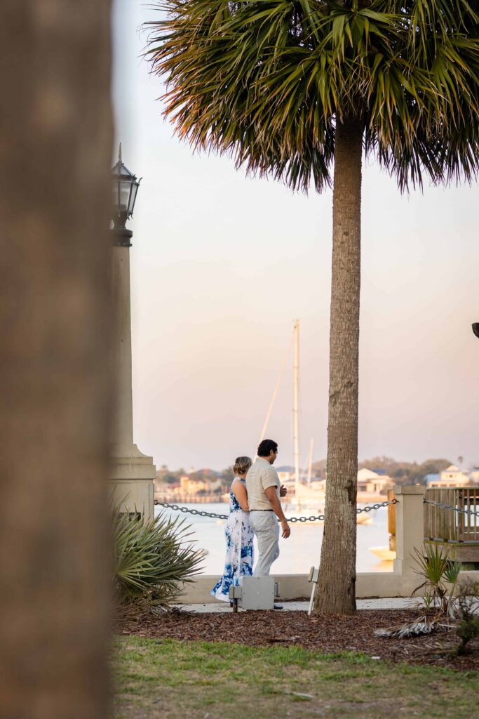 A proposing in St. Augustine at the bay front | Sunset proposal Captured by Phavy Photography, St. Augustine Proposal Photographer