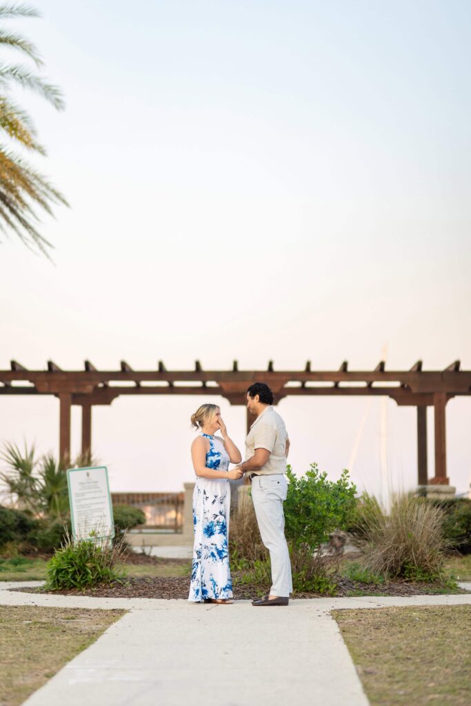 A proposing in St. Augustine at the bay front | Sunset proposal Captured by Phavy Photography, St. Augustine Proposal Photographer