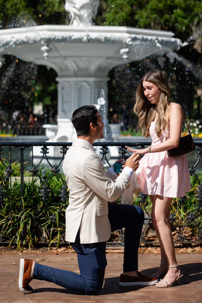 Proposing to his girlfriend at the fountain of Forsyth Park, Savannah