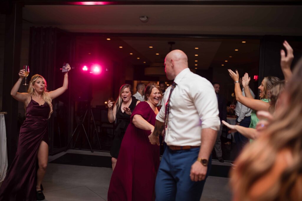 Wedding reception fun at the Thompson Savannah | Documentary style wedding photographer in Savannah