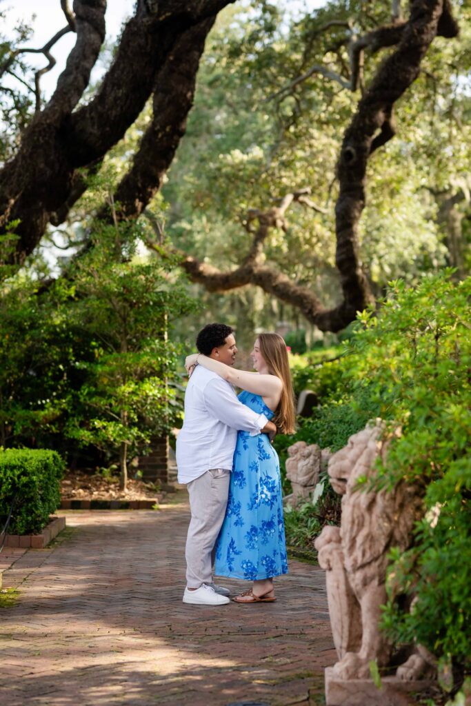 Hidden photographer capturing a proposal in the Italian Garden at Cummer Museum, Jacksonville