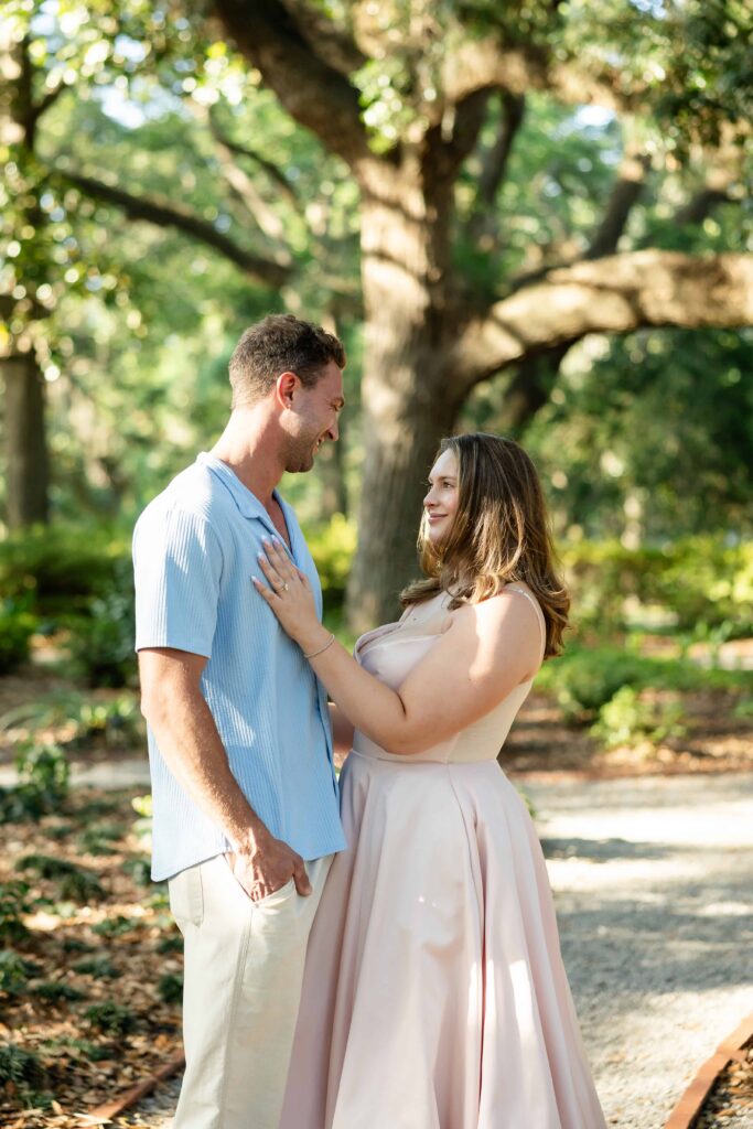 Newly engaged couple celebrating in Savannah's historic Forsyth Park