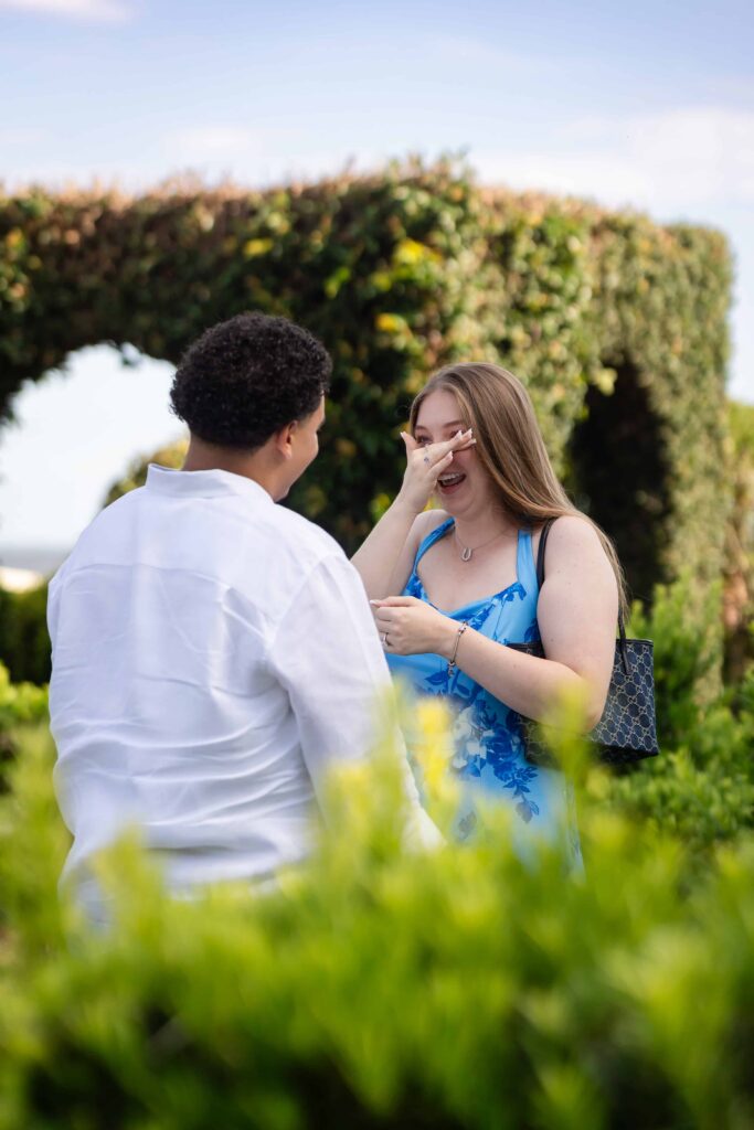 Hidden proposal photographer capturing surprise engagement at Cummer Museum, Jacksonville, FL