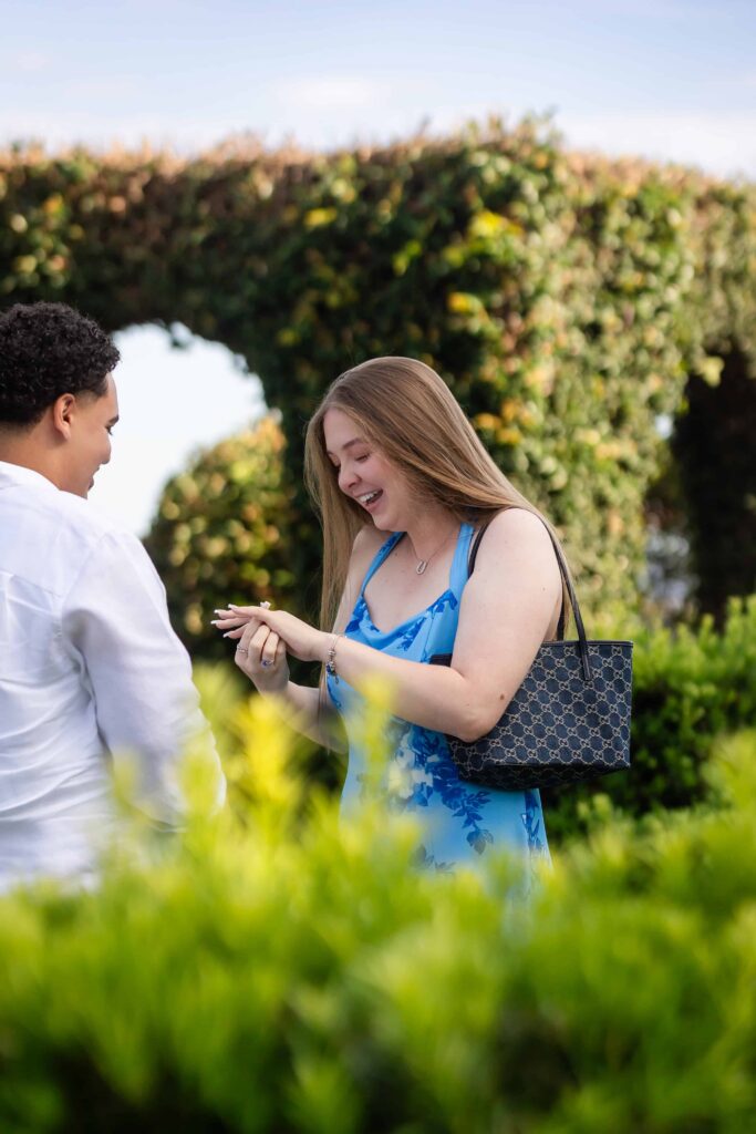 Emotional proposal reaction photographed at Cummer Museum, Jacksonville