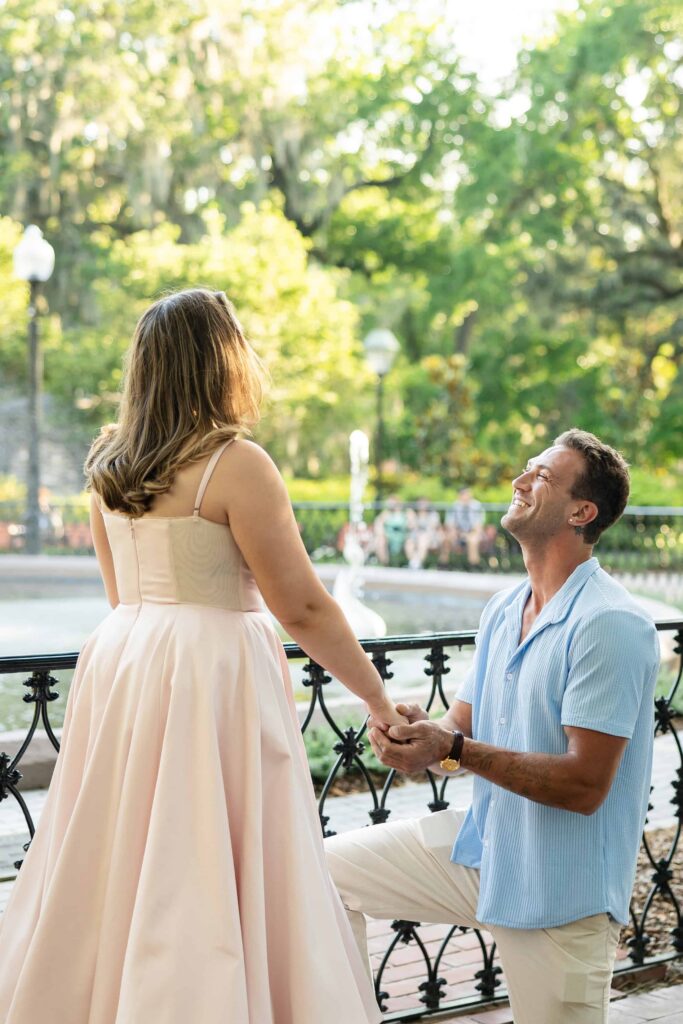 Surprise proposal at Forsyth Park with the historic Savannah fountain in the background